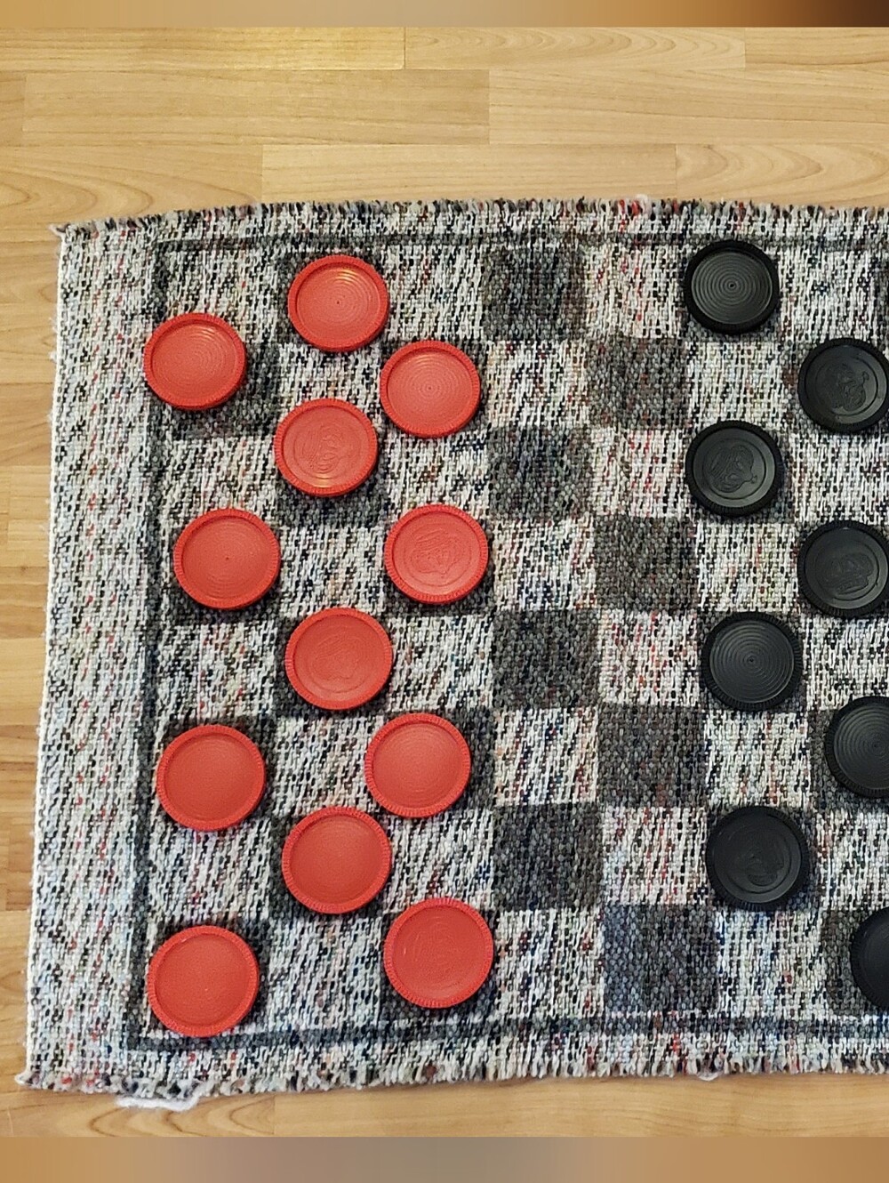Handwoven Checkered Game Mat with Red and Black Checkers